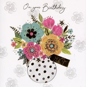 A birthday card with a vase of flowers and the words "on your birthday".