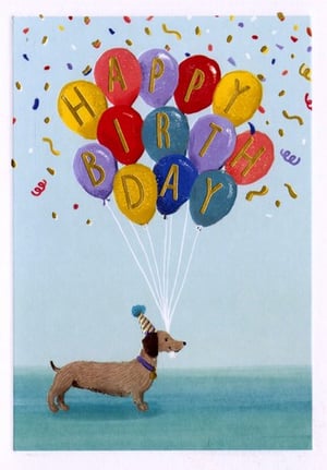 A dachshund is holding a bunch of balloons that say "Happy Birthday."