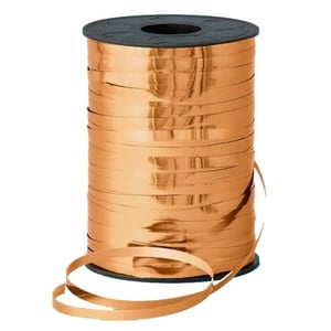 a spool of copper colored ribbon with a black cap