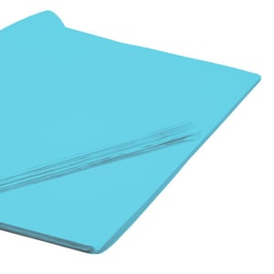 a piece of blue paper is laying on a white surface