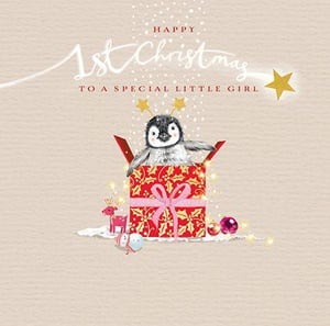 a penguin is sitting in a gift box on a christmas card .