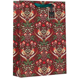 a gift bag with birds and flowers on it