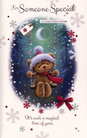 a christmas wish card with a teddy bear on a swing