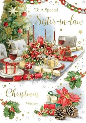 a christmas card for a special sister-in-law with a table set for a christmas dinner .