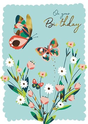 two butterflies are flying over a bouquet of flowers on a birthday card .