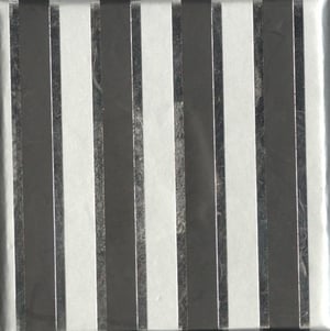 a close up of a metal surface with black and white stripes