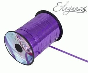 a roll of purple ribbon on a white background .
