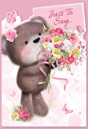 A teddy bear is holding a bouquet of flowers and says "just to say."
