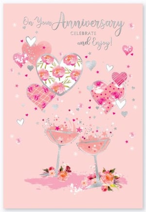 A pink anniversary card with hearts and champagne glasses.