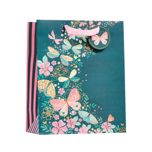 a gift bag with butterflies and flowers on it