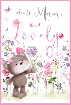 a mother 's day card with a teddy bear in a field of flowers