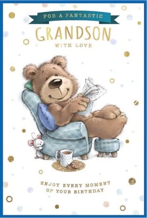 a teddy bear is sitting in a chair reading a newspaper .