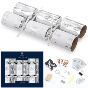 a box of tom smith crackers with cards and other items