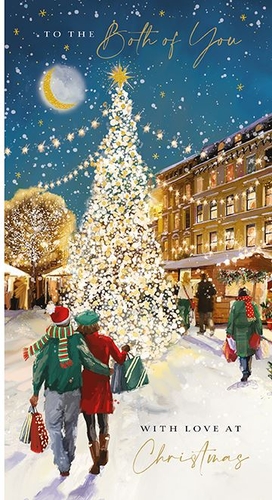 a christmas card with a couple walking in front of a christmas tree .