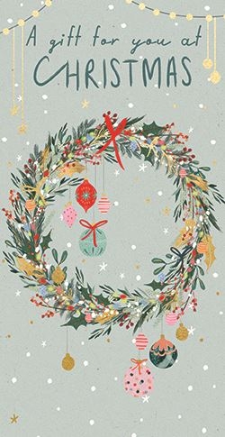 a christmas card with a wreath on it and the words `` a gift for you at christmas '' .