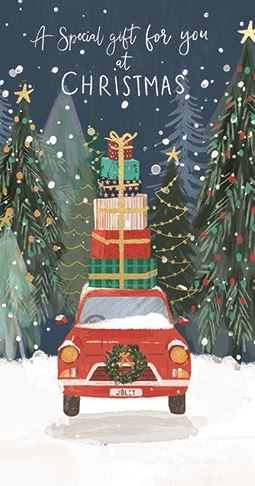a red car with gifts on top of it is driving down a snowy road .