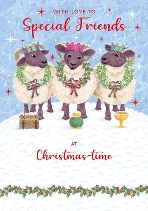 three sheep wearing wreaths and crowns are standing in the snow on a christmas card .