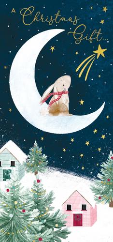 a rabbit is sitting on a crescent moon in a christmas card .