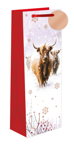 a gift bag with a picture of a herd of cows in the snow
