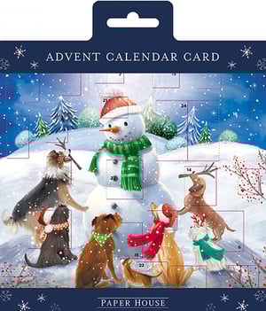 a paper house advent calendar card with dogs and a snowman