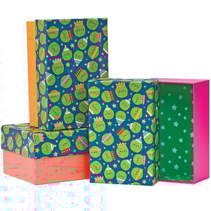 a stack of boxes with a pattern of green circles and stars