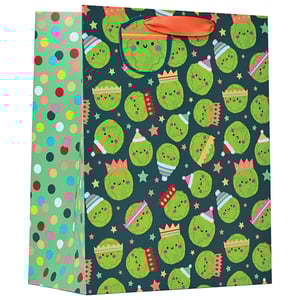 a gift bag with a pattern of frogs wearing party hats