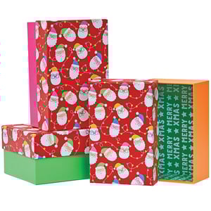 a stack of christmas boxes with one that says merry xmas on it