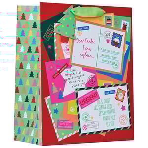 a christmas gift bag with letters from santa on it