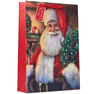 a red gift bag with a tag that says merry christmas