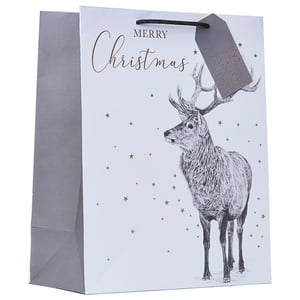 a merry christmas gift bag with a deer on it
