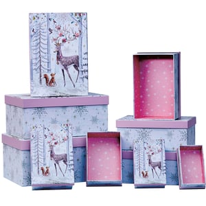a stack of boxes with deer and snowflakes on them