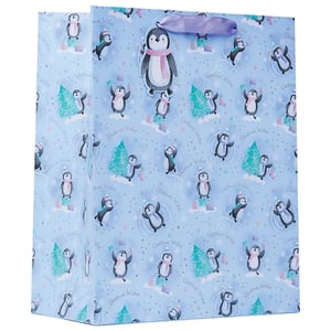 a blue gift bag with penguins and christmas wishes on it