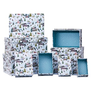a stack of boxes with a snowy scene on them