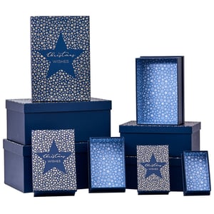 a stack of blue boxes that say christmas wishes