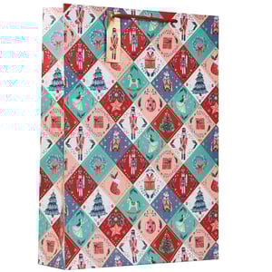 a gift bag with a nutcracker pattern on it