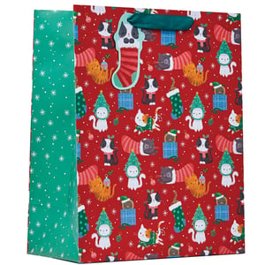 a red and green christmas bag with cats on it