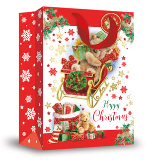 a christmas bag with a teddy bear in a sleigh and the words happy christmas