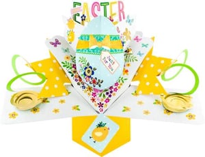 a pop up easter card with an easter egg and flowers on it .
