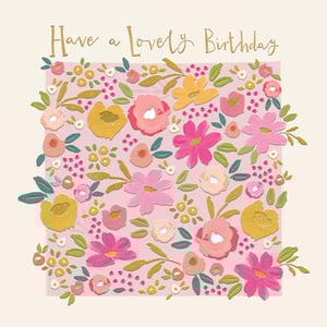 Brighten any birthday with this charming 'Open Birthday Female' card from the Great British Card Company. Adorned with a beautiful, hand-painted style floral design, this card bursts with vibrant colour and texture. A delightful mix of pink, fuchsia, peach, and golden yellow flowers are artfully arranged on a soft pink background, complemented by lush green foliage and delicate berry accents. The elegant gold script message, 'Have a Lovely Birthday', adds a touch of warmth and sophistication. This lovely card is perfect for sending heartfelt wishes and is sure to make any recipient feel cherished. Supplied in a convenient pack of 6, it's an ideal choice for your greeting card collection.