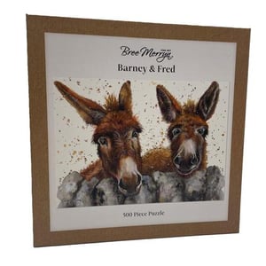 a 500 piece puzzle of two donkeys standing next to each other .