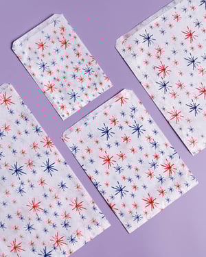 four white bags with red , white and blue stars on them
