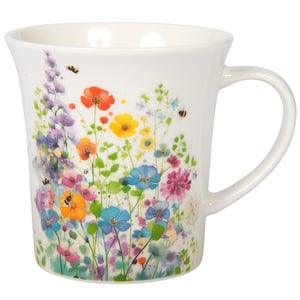 a white mug with flowers and bees on it
