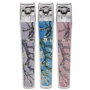 three nail clippers with different designs on them