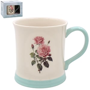 a white coffee mug with pink roses on it