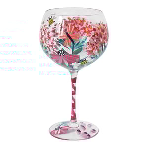 a wine glass with flowers and bees painted on it