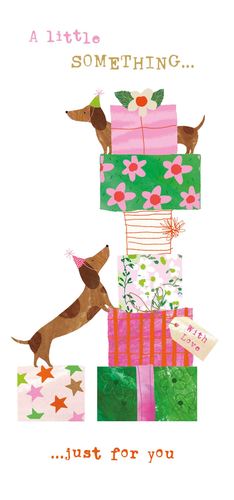 a dachshund is standing on top of a stack of gifts .