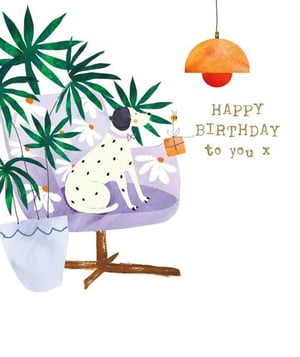 a dalmatian dog is sitting in a chair holding a gift .