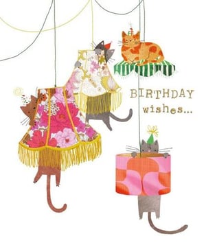 a birthday card with three cats hanging from lamps .