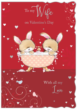 Celebrate love this Valentine's Day with our adorable 'Wife' card, perfect for showing that special someone just how much they mean to you. This charming design features two irresistibly cute bunnies enjoying a bubbly bath, surrounded by a flurry of hearts and elegant swirls on a vibrant red background. The heartfelt message, 'To my Wife on Valentine's Day, With all my Love,' beautifully conveys affection. Crafted with care by Out of The Blue Studios Ltd., this delightful card is sure to bring a smile to your wife's face. Available in a convenient pack size of 1x6, ensuring you're stocked for the season of love.