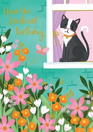 a black and white cat is sitting in a window surrounded by flowers .